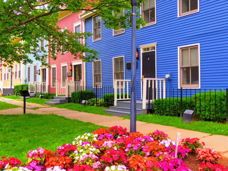 Street view of brightly colored suburban townhouses